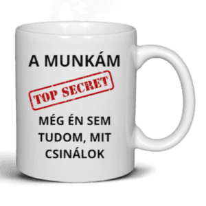 Fehér kerámia bögre humoros felirattal: 'A munkám TOP SECRET – Még én sem tudom, mit csinálok' – vicces ajándék irodai dolgozóknak.